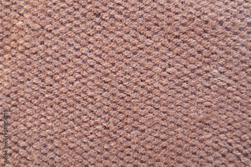 Close up of fabric texture in pink brown colors. Colorful wool yarn cloth background. 