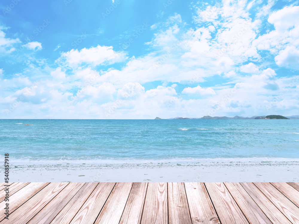 Empty wooden table for displaying products. The background is sea view blue sky and white clouds.
(with copy )