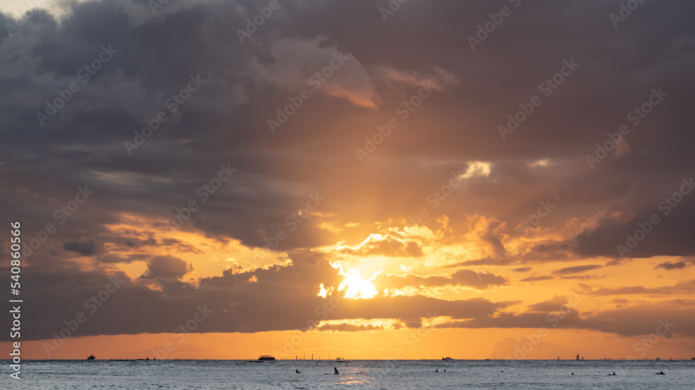 Incredible sunset clouds over a Hawaiian beach. 
