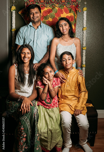 Diwali portrait of a family wearing traditional attire 