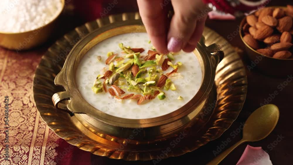 Sabudana Kheer thick pudding with tapioca pearls sago dessert from cassava root Indian sweet mithai chowari payasam for Mahashivratri Ram Navami Diwali festival 4k video footage