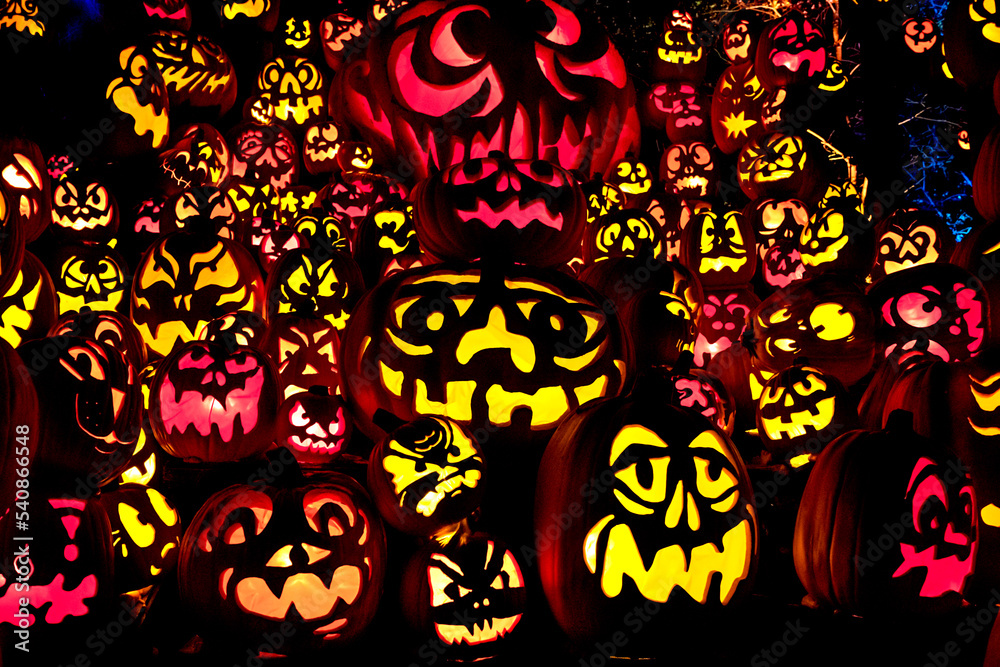 Carved Jack-o-lanterns lit at night for Halloween Carved Jack-o-lanterns lit at night for Halloween
