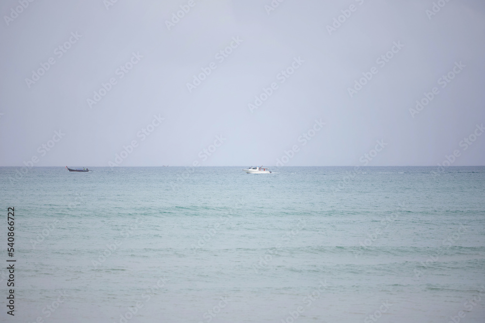 Speed boat and longtail boat in th tropical sea