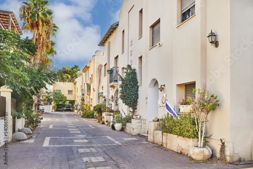 Fototapeta Naklejka Na Ścianę i Meble -  Nice Israeli courtyard with Mediterranean-style residential buildings