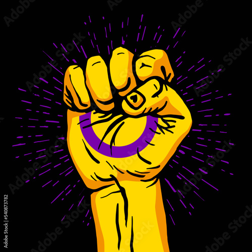 A human hand clenched into a fist. The flag of intersex pride. Circle in hand. A colorful logo of one of the LGBT flags. Sexual identification.