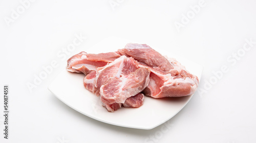 Raw soft pork ribs isolated on plate .White background.