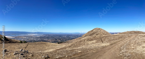 Aerial panoramic view of south San Francisco Bay Area from hiking trail leading to Mission Peak during fall season