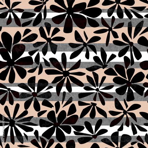 Seamless simple floral pattern. Black flowers on a light striped background.