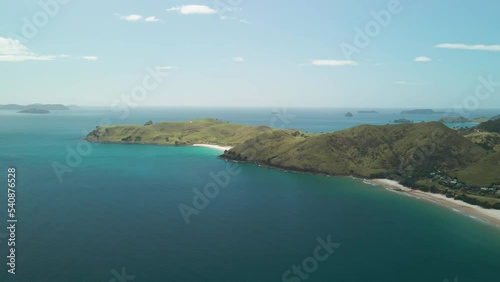 Watching waves slowly roll into shore in the Coromandel Peninsula photo