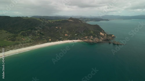 Drone coming into land slowly on a beach in New Zealand photo