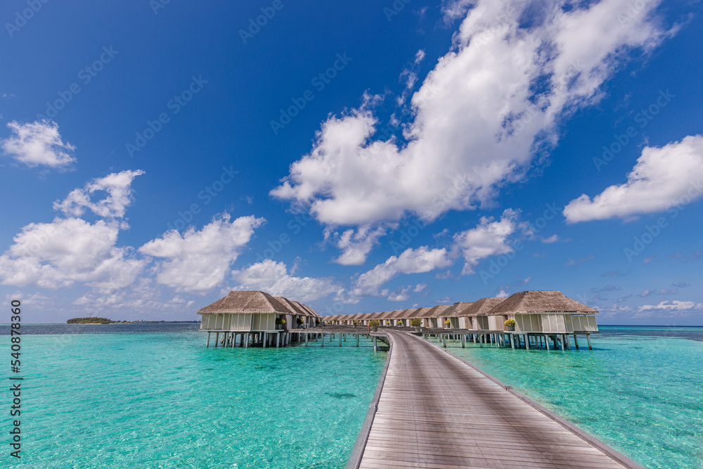 Amazing beach landscape. Beautiful Maldives lagoon bay seascape view. Horizon sunny sea sky clouds, over water villa pier pathway. Tranquil island lagoon, tourism travel background. Exotic vacation