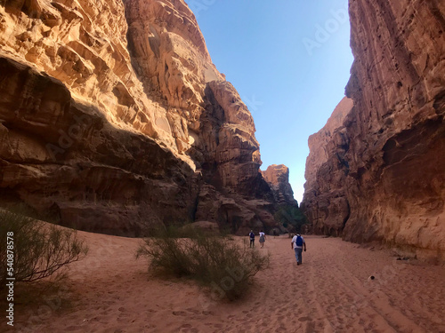 Wadi Rum, Jordan, November 2019 - A group of people in a canyon