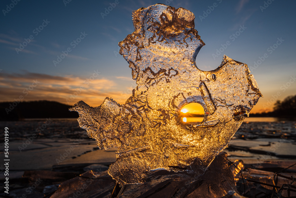 Ice formation on shoreline at sunset