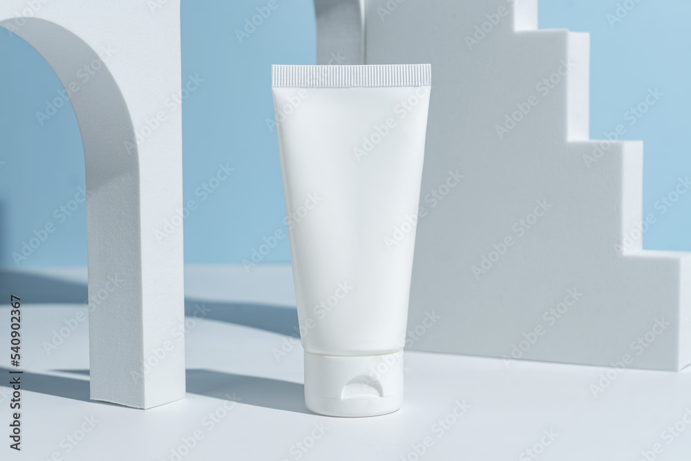 Beauty product mockup. Wellness packaging. Branding spa. Cosmetic on blue background. Cream bottle, lotion, mousse, cleanser, shampoo for skincare routine. Copy space Beauty product mockup. Wellness packaging. Branding spa. Cosmetic on blue background. Cream bottle, lotion, mousse, cleanser, shampoo for skincare routine. Copy space