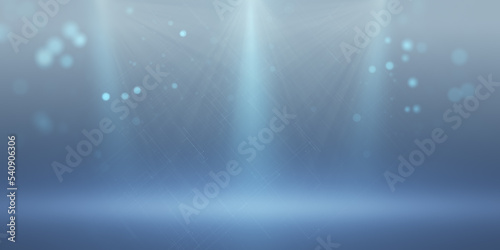 Bright wide blue background with spotlight. Stage, light and music concept.