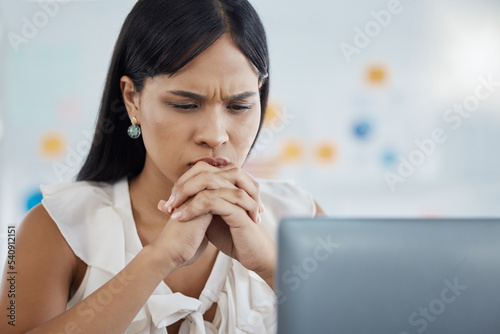 Anxiety, stress and business woman on laptop in office, reading email of phishing, 404 or glitch. Thinking, worry and burnout with corporate employee frustrated by loan rejection and startup fail photo