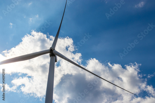 Wind turbine generate electricity with blue sky at Khao Kho Thailand. © praewpailyn