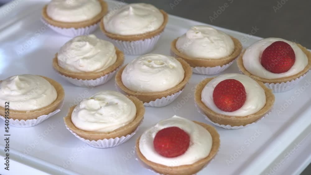 pastry chef decorating cakes with fresh fruits pastry chef decorating cakes with fresh fruits
