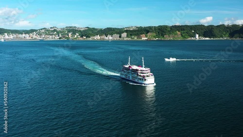 Ferry leaving Kagoshima City towards Sakurajima Island; aerial view photo