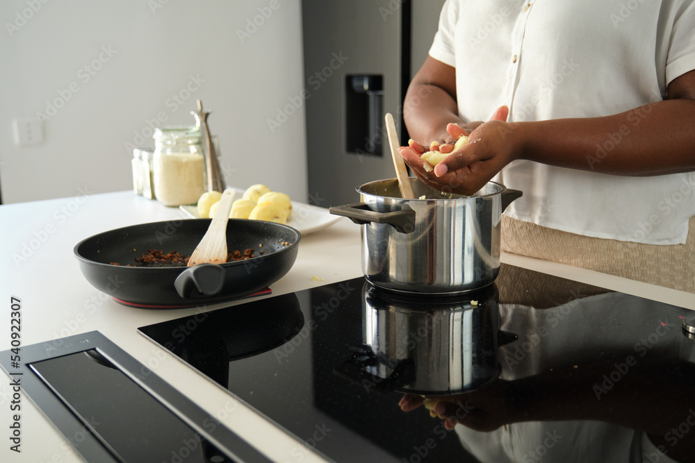 custom made wallpaper toronto digitalClose up of cuban woman hands moulding mashed potatoes into a ball to prepare cuban style stuffed potatoes.