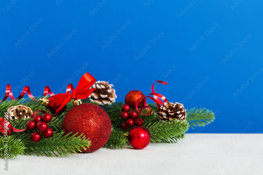 New Year Christmas tree toy, branches of a christmas tree, New Year decorations on a colored background