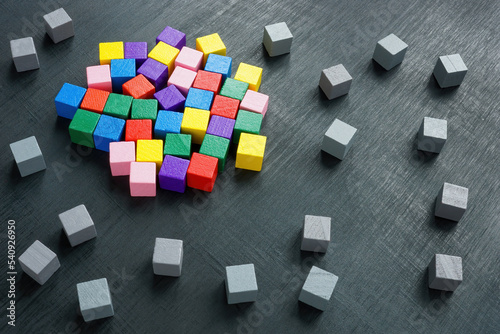 Integration, diversity and inclusion concept. Multi-colored cubes surrounded by gray ones.