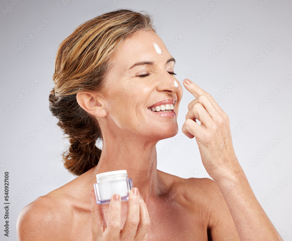 Beauty, senior and face of woman with cream container for skincare hydration and anti aging. Grey studio mockup for facial creme product advertising with happy smile of ageing elderly lady. Beauty, senior and face of woman with cream container for skincare hydration and anti aging. Grey studio mockup for facial creme product advertising with happy smile of ageing elderly lady.
