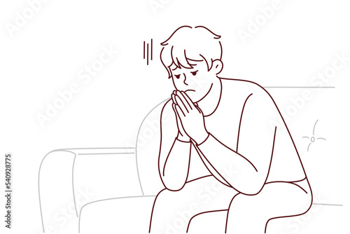 Unhappy young man sit on sofa thinking worrying about life problem. Upset stressed male on couch at home distressed and broken. Vector illustration.