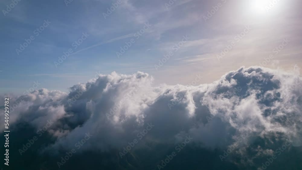 Time lapse of clouds quickly passing over the top of a mountain range. Time lapse of clouds quickly passing over the top of a mountain range.