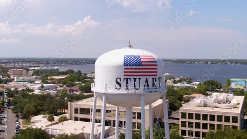 Aerial parallax orbiting round water tank in city Stuart, Florida photo