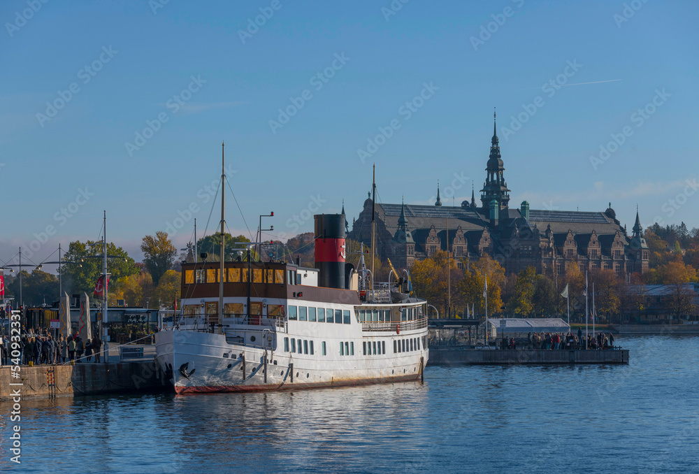 Tourists enter a steam boat for a sightseeing tour in the archipelago a colorful autumn day in Stockholm