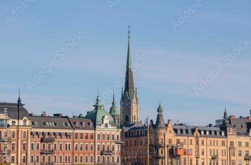 Facades  roofs church tower in the district   stermalm a colorful autumn day in Stockholm