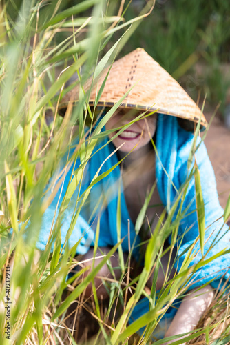 young girl with a Vietnamese straw hat