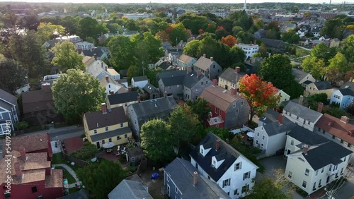 New England USA. Colonial view. Houses in residential community in autumn fall foliage. Aerial establishing shot. photo