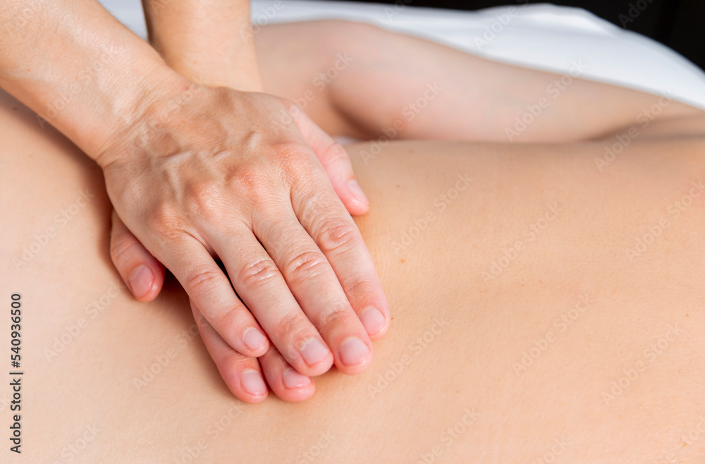 Young woman at the spa receiving a full body massage Young woman at the spa receiving a full body massage