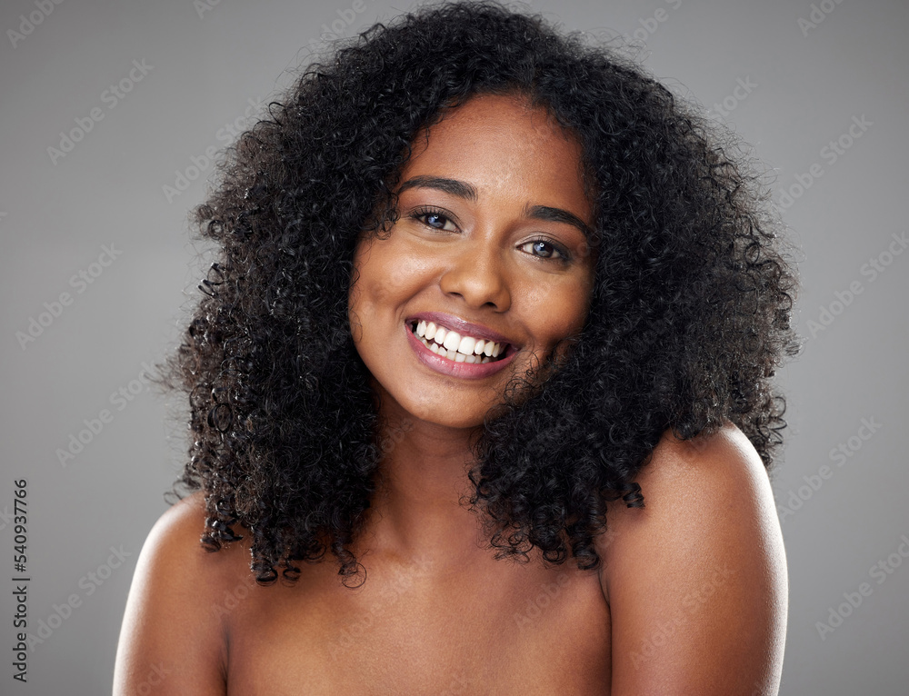 Happy, smile and portrait of a young woman with clean, beautiful and  natural hair in a