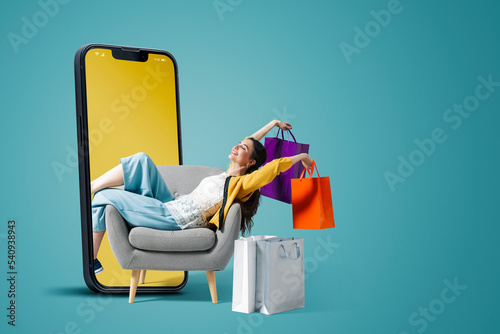 Fashionable woman doing online shopping photo