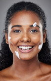 Black woman, beauty and facial skincare moisturizer, cream or lotion with smile for cosmetics against grey studio background. Portrait of happy African American female face smiling for skin treatment