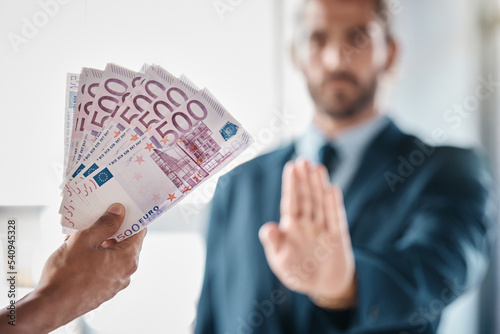 Bribe, money and fraud businessman stop hands for money laundering, corruption and business deal exchange. Crime, ethics and lawyer business people euro cash offer for financial scam or secret profit photo