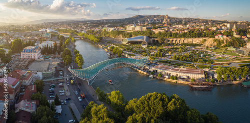 Aerial view of downtown Tbilisi, Georgia. In the foreground is the Peace Bridge over the Mtkvari River. photo