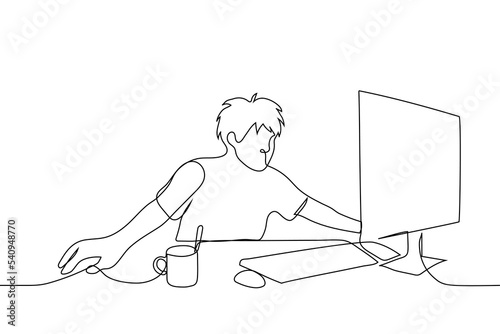 shaggy man spread wide on his desk looking at the computer monitor screen - one line drawing vector. concept tired freelancer, burnout