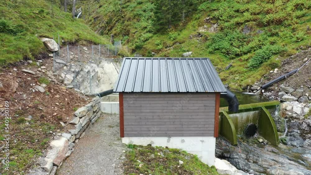 Valve control house and small intake dam for hydroelectric river powerplant Markaani in Vaksdal Norway - Low water level in mountains during summer Valve control house and small intake dam for hydroelectric river powerplant Markaani in Vaksdal Norway - Low water level in mountains during summer