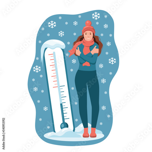 A woman froze in winter with a cold temperature. Meteorology thermometer.