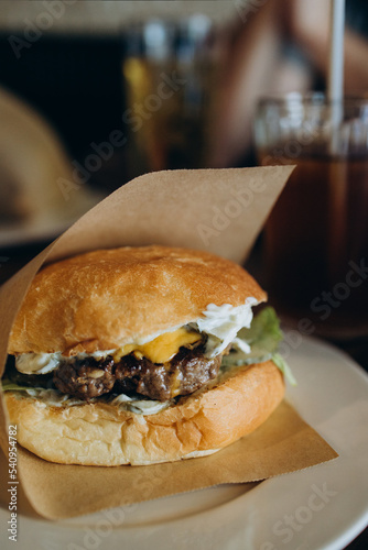 Burger on a table in a cafe