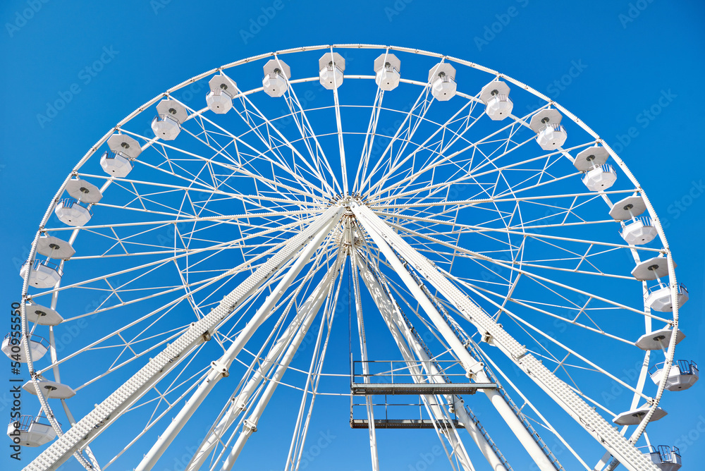 Ferris wheel on blue sky