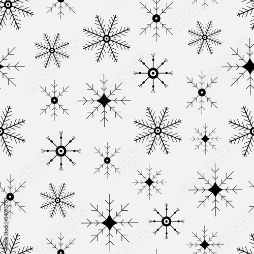 Seamless pattern of black snowflakes. Hand drawn winter background. Doodle Christmas snowflakes vector print for textile  fabric  wrapping  paper  packaging