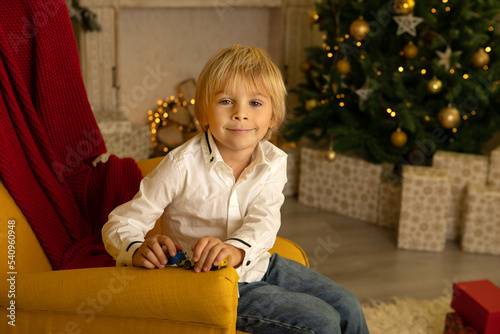 Cute child, boy, playing in a decorated room for Christmas © Tomsickova
