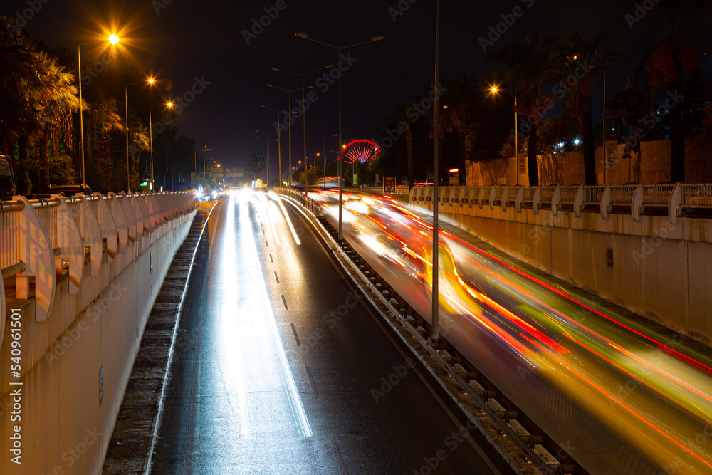 Night traffic, car lights at night on a city street Night traffic, car lights at night on a city street