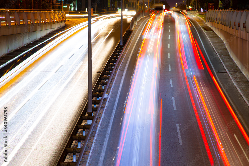 Night traffic, car lights at night on a city street Night traffic, car lights at night on a city street