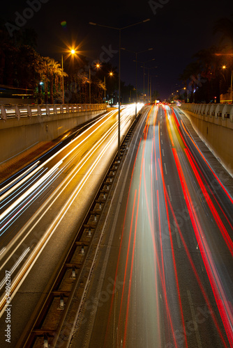 Night traffic, car lights at night on a city street